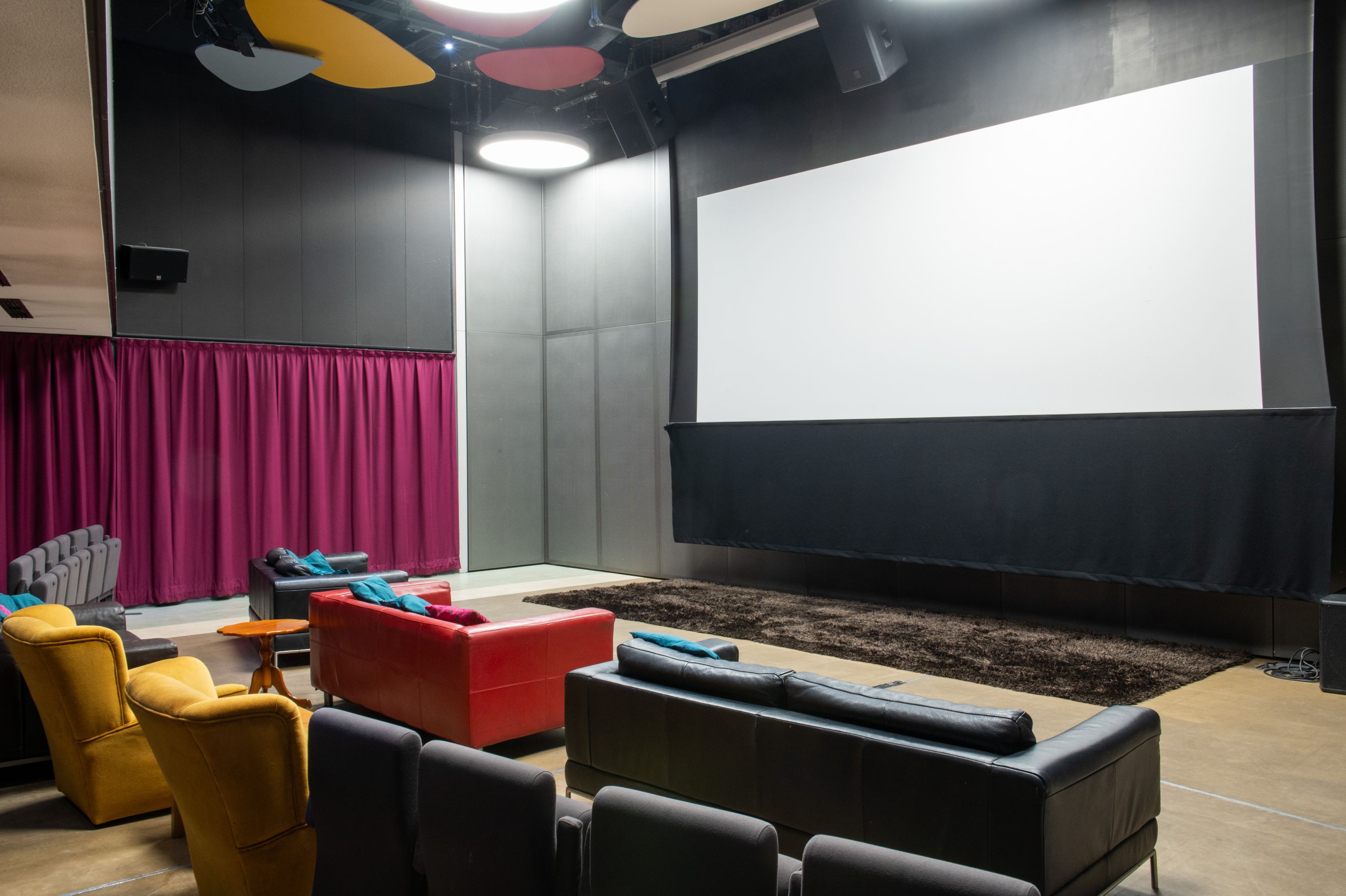 Image Credit: Jon Legge Inside 'The Box' with a projection screen and comfortable seating